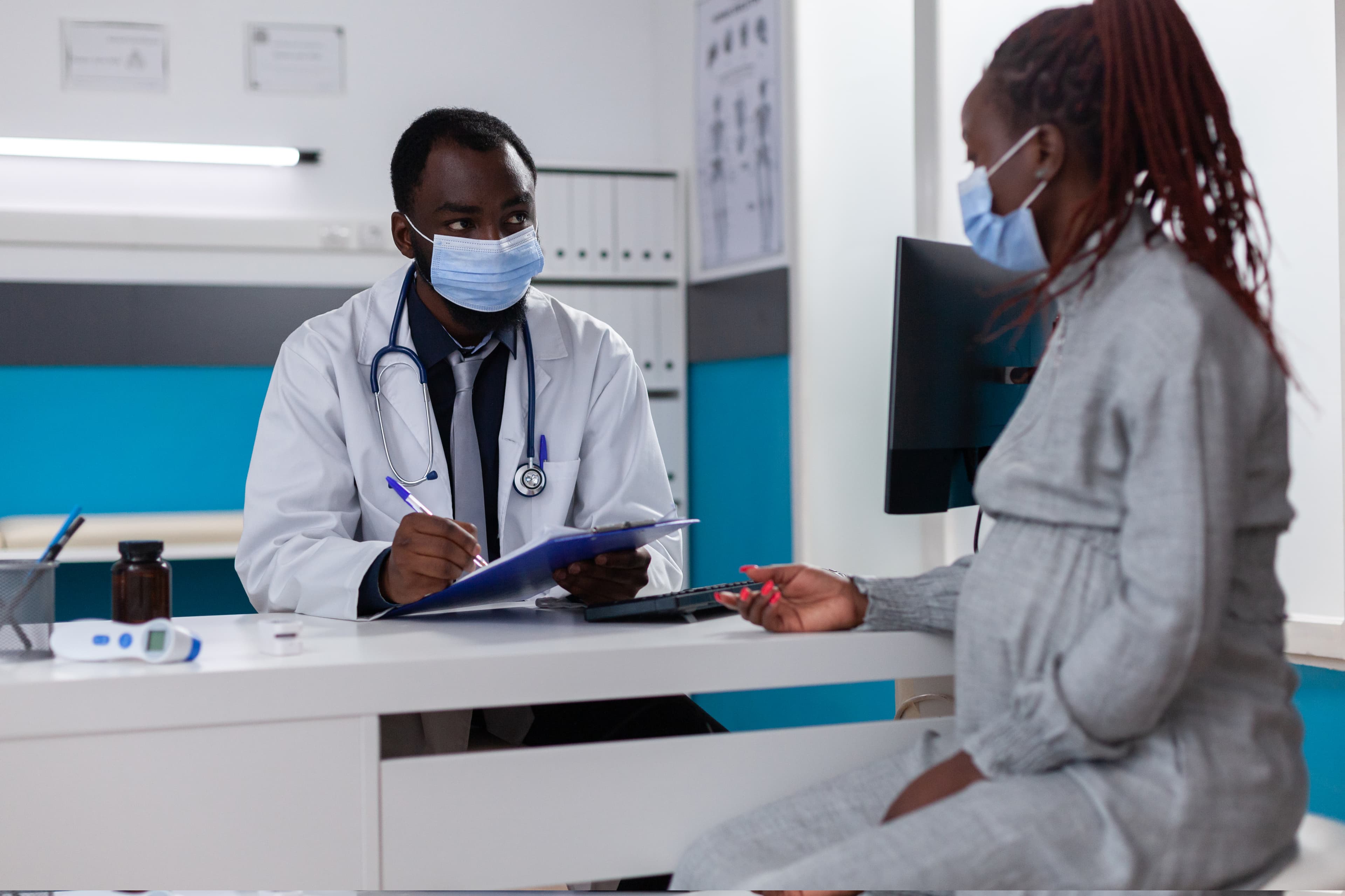 Doctor consulting with patient